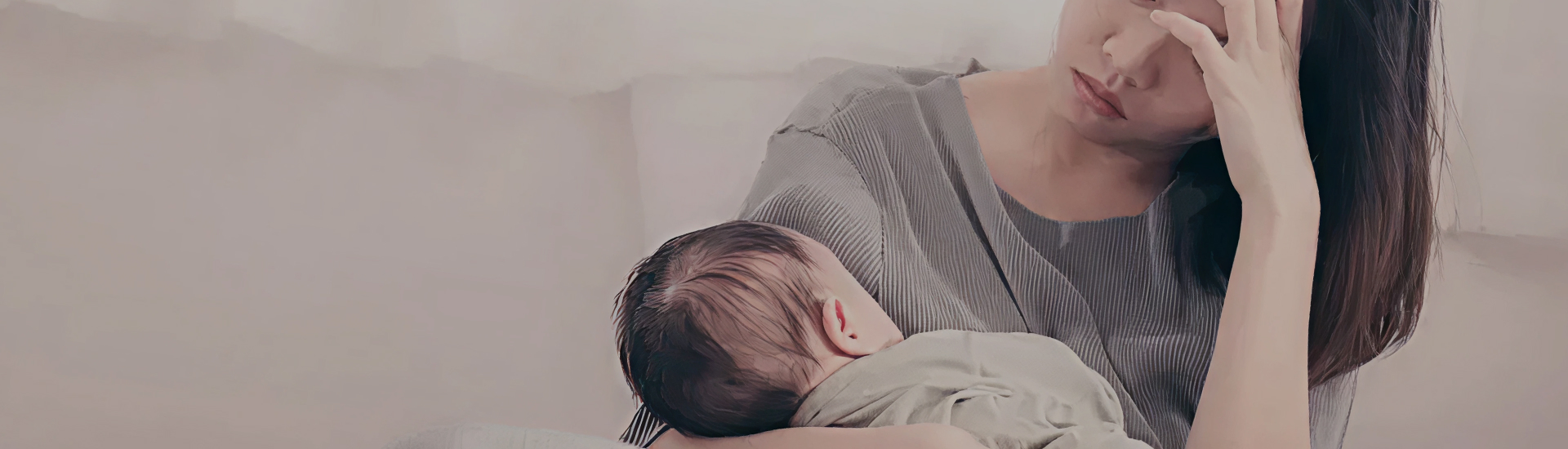 A tired and distressed-looking mother breastfeeds her baby while resting her head on her hand. Her body language suggests fatigue, emotional strain, or overwhelm, highlighting the mental load of early motherhood.