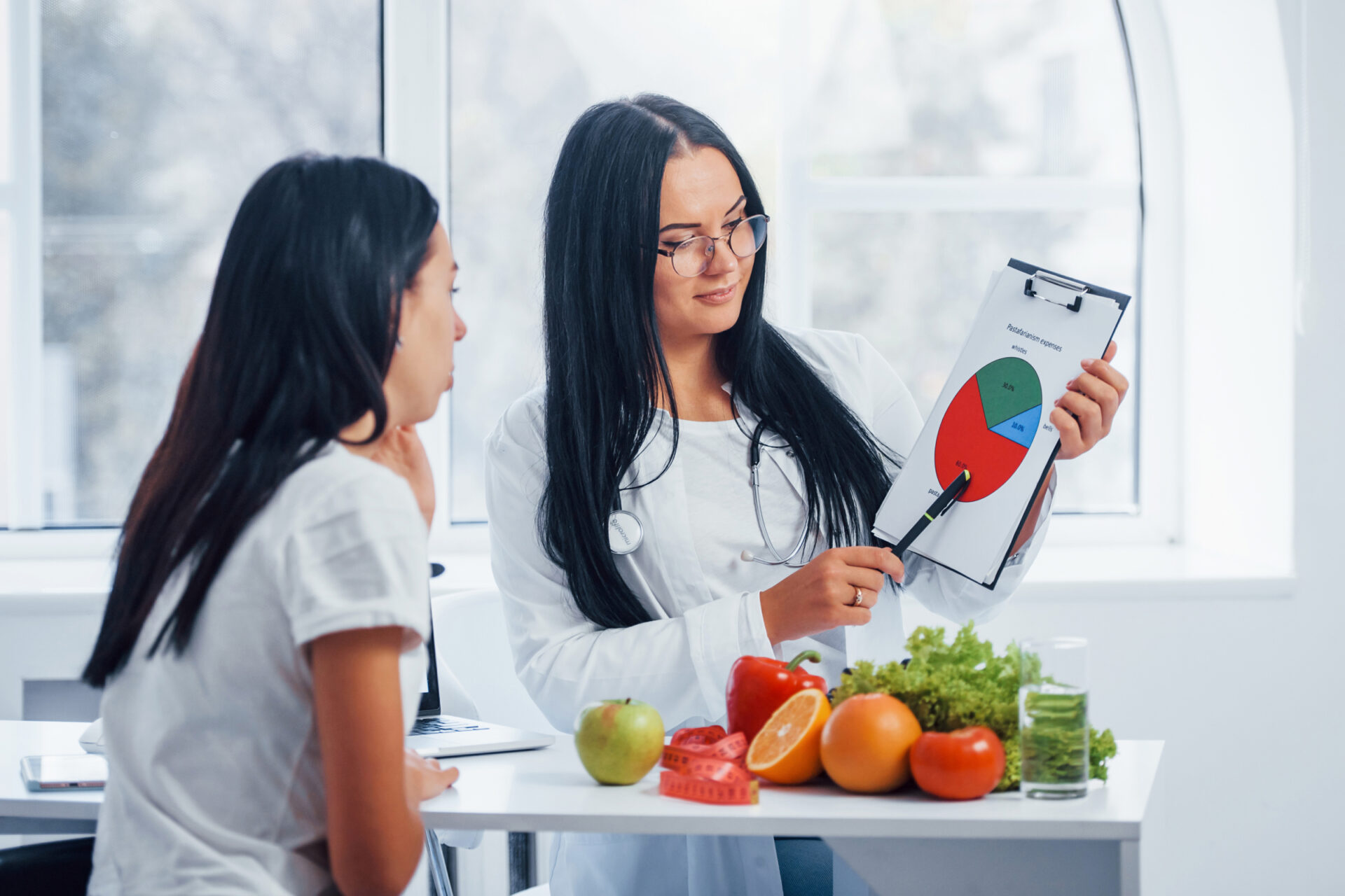 A new mother preparing nutritious meals with guidance from a postpartum nutritionist at Spring Integrative Wellness.