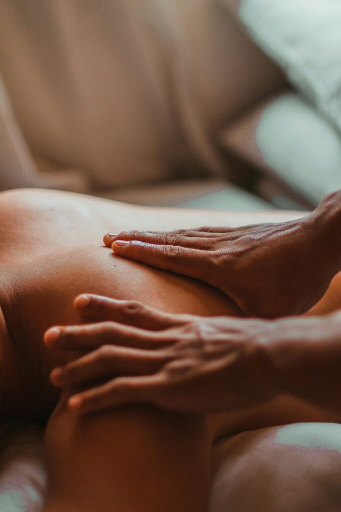 New mother receiving a postpartum massage for recovery and relaxation in Edmonton.