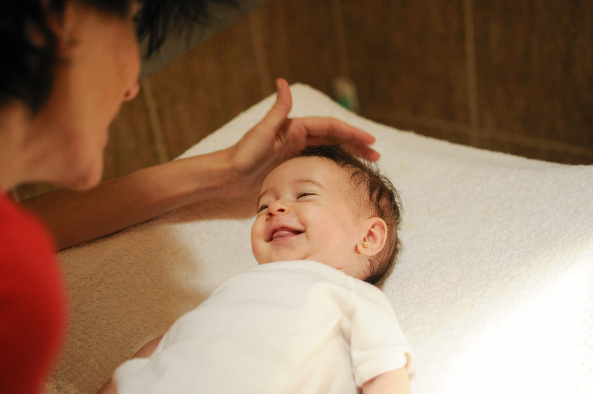 Child receiving pediatric massage therapy for relaxation and physical well-being.