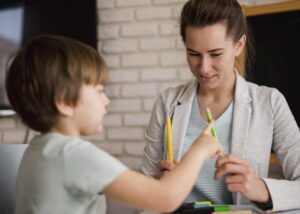 Therapist guiding a child through coping techniques to build emotional resilience in Edmonton.